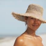 Beach,Woman,In,Sun,Hat,On,Vacation